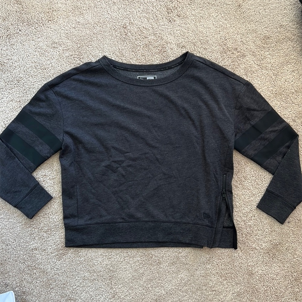Dark gray crew neck with stripes on the arms